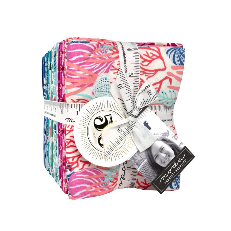 A bundle of fabric swatches with a measuring tape wrapped around them, and a label with a photo of a smiling woman.