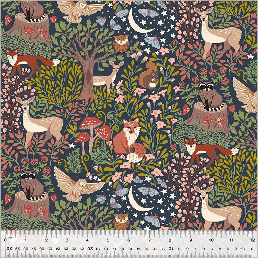 a fabric with a forest scene and animals on it