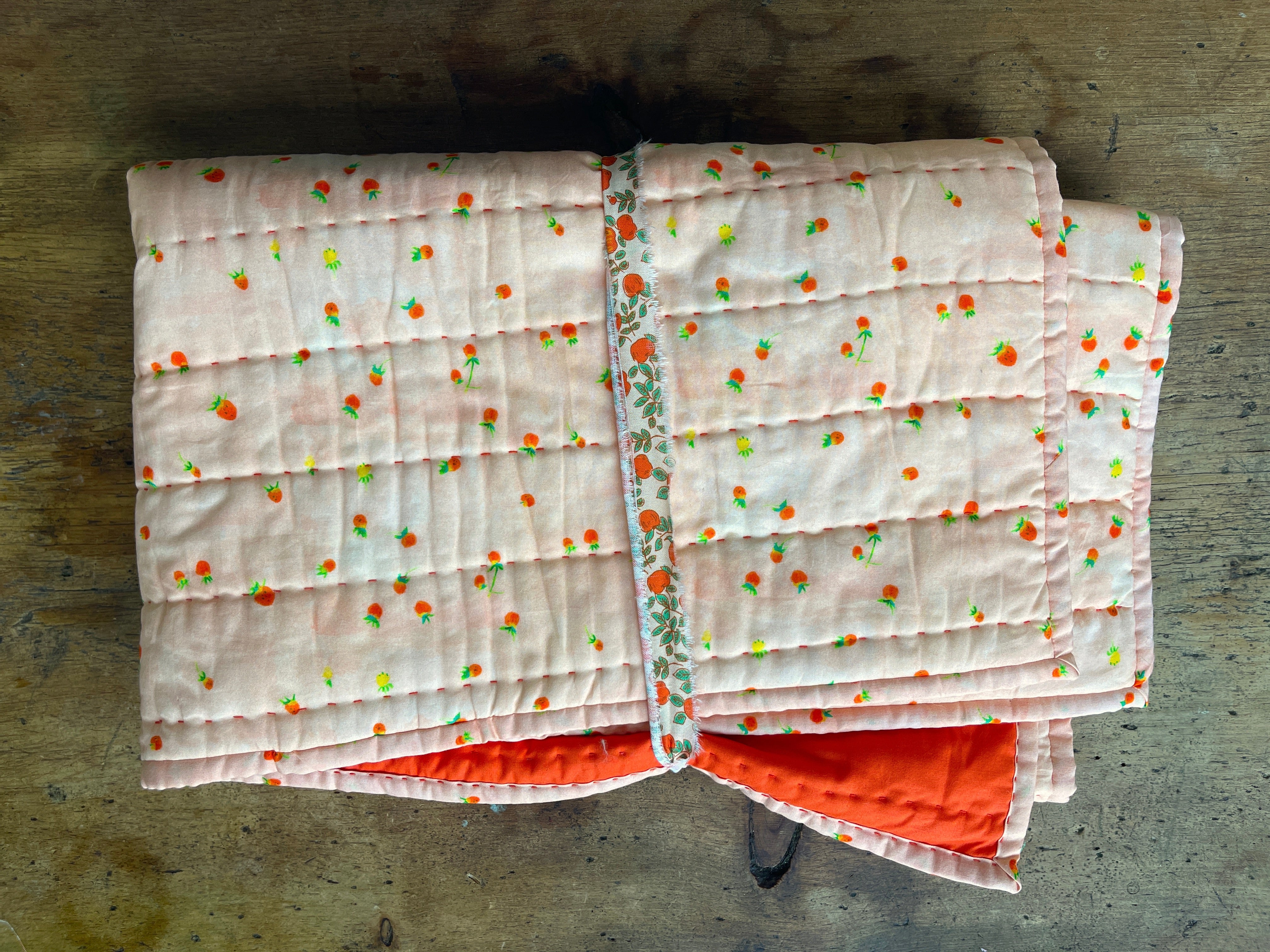 a close up of a quilt on a table
