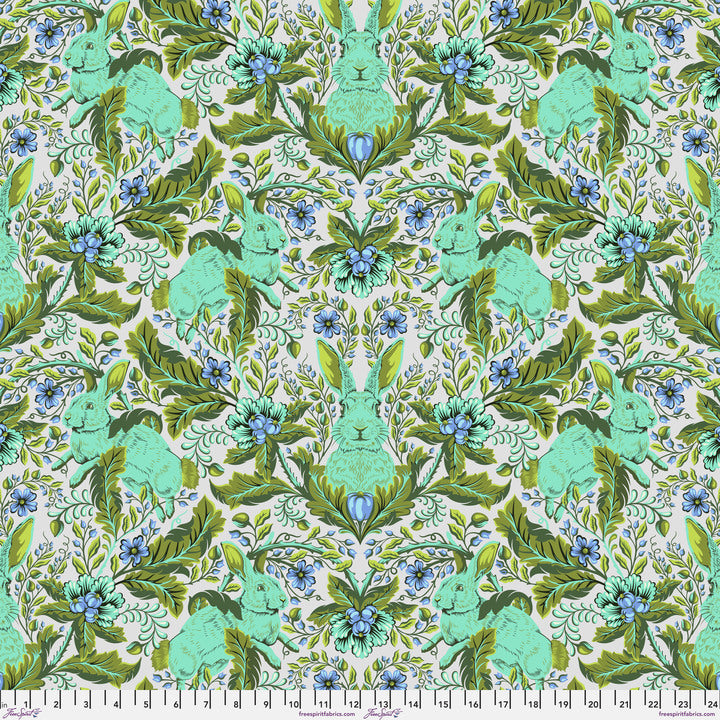a green and blue floral pattern on a white background