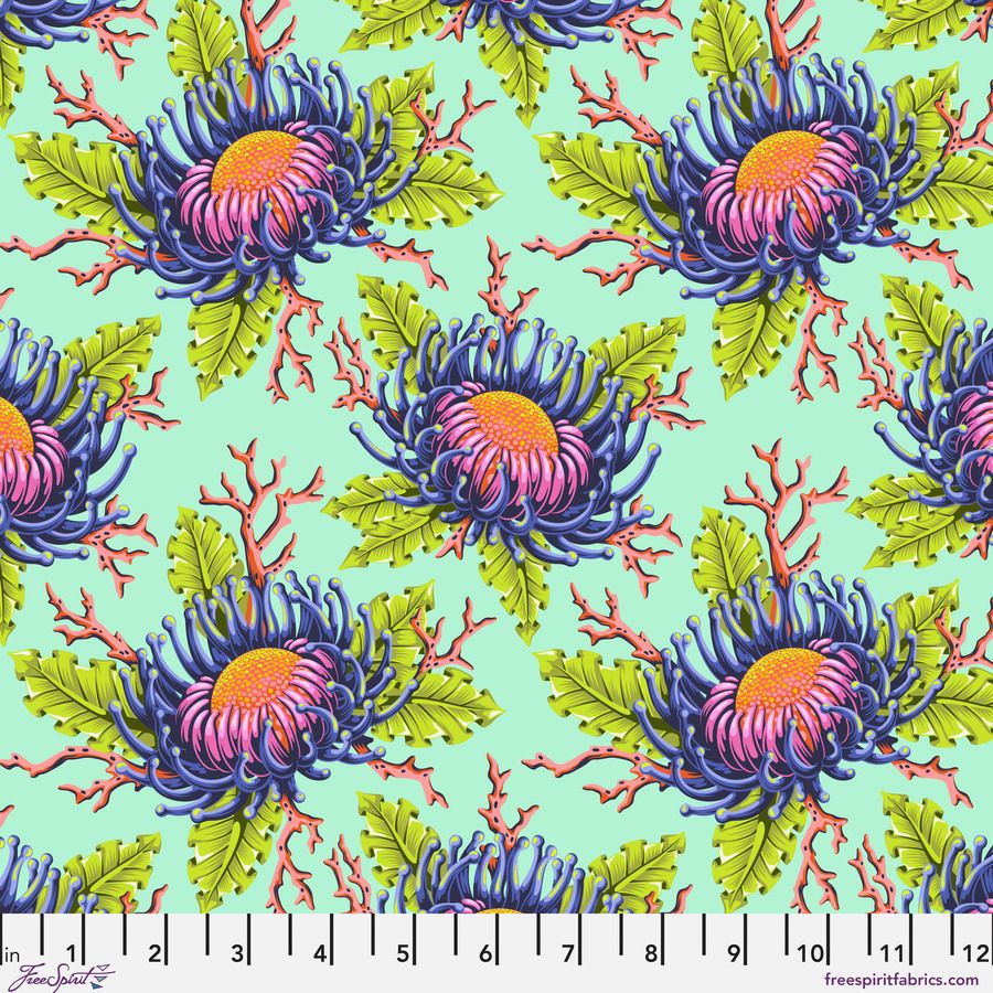 a repeating pattern of vibrant, colorful flowers with green leaves and orange centers against a light blue background.