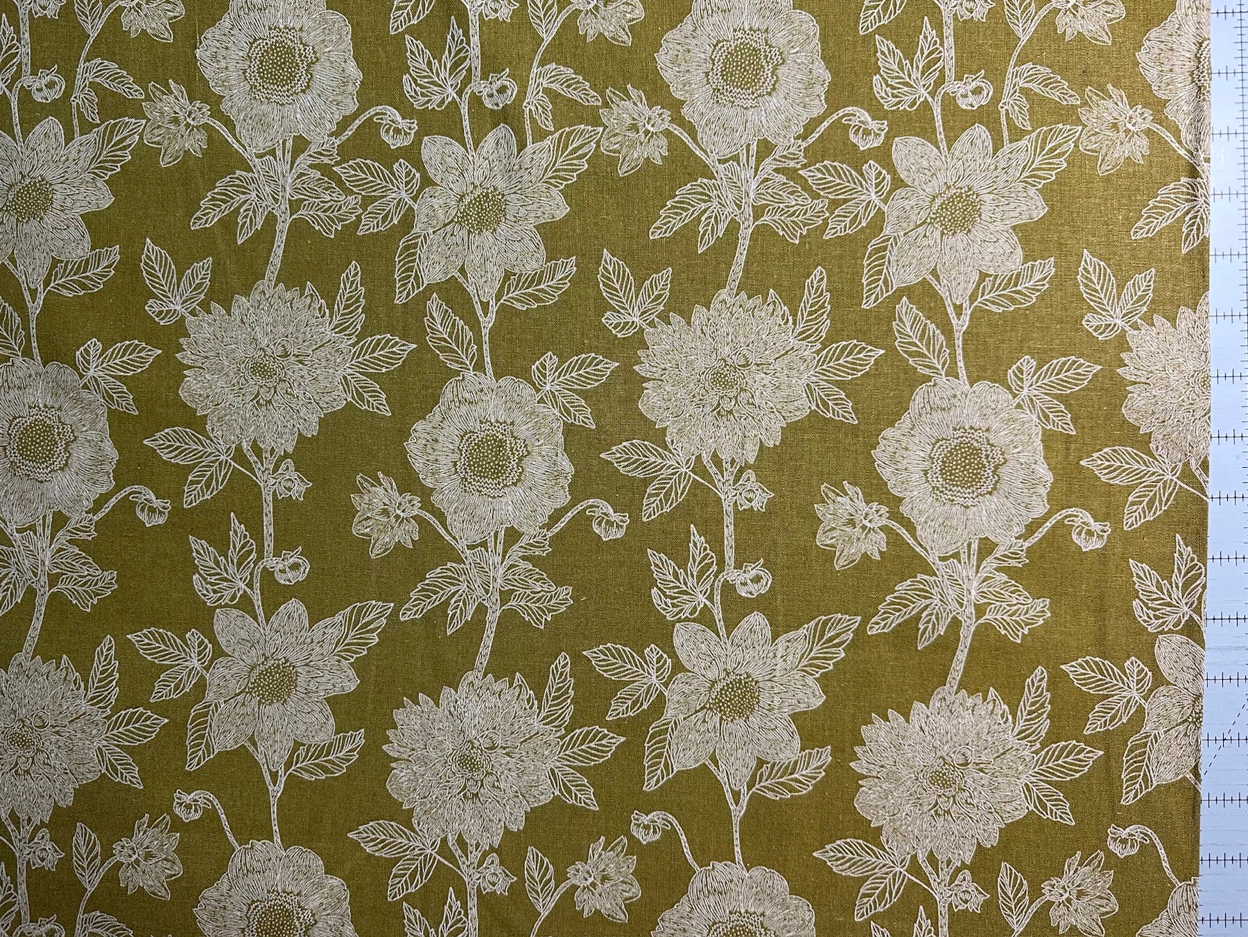 a repeating pattern of white flowers on a green background.