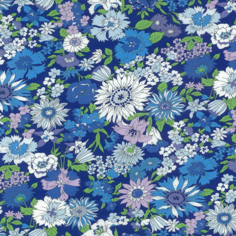 The image is a vibrant and colorful collage of various flowers and foliage in shades of blue, white, and purple. The flowers are arranged in a visually appealing manner, creating a lively and dynamic pattern across the image.