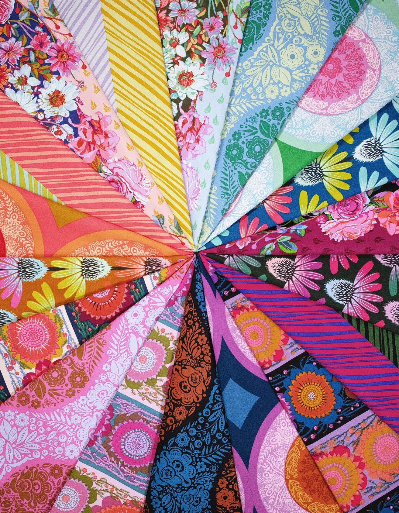 The image is a vibrant collage of various colorful fabric patterns and designs, including floral motifs, stripes, and abstract shapes, arranged in a radial pattern.