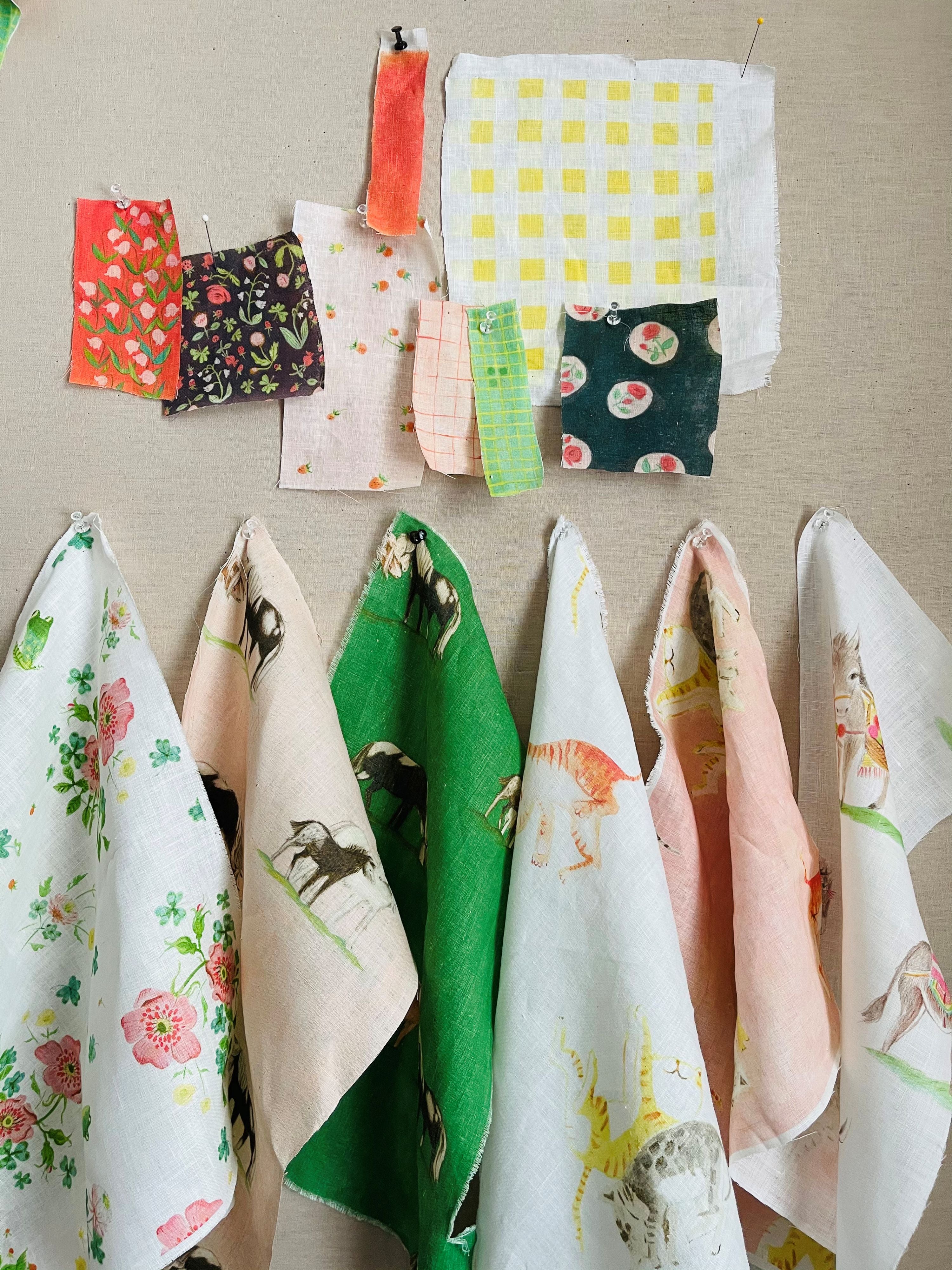 a bunch of cloths hanging on a wall