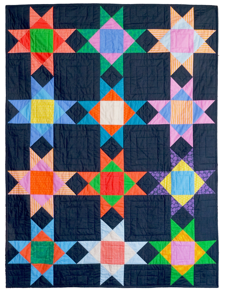 a black quilt with multicolored stars on it