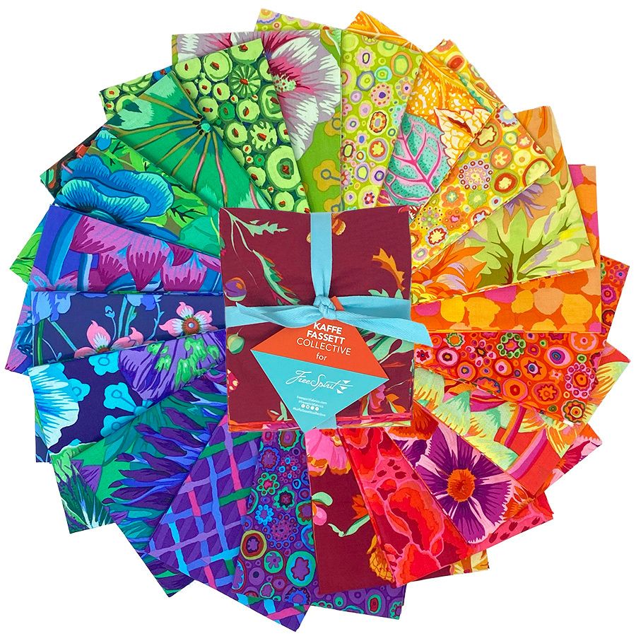 The image is a vibrant display of various colorful fabric swatches arranged in a circular pattern, showcasing a diverse range of patterns and colors.
