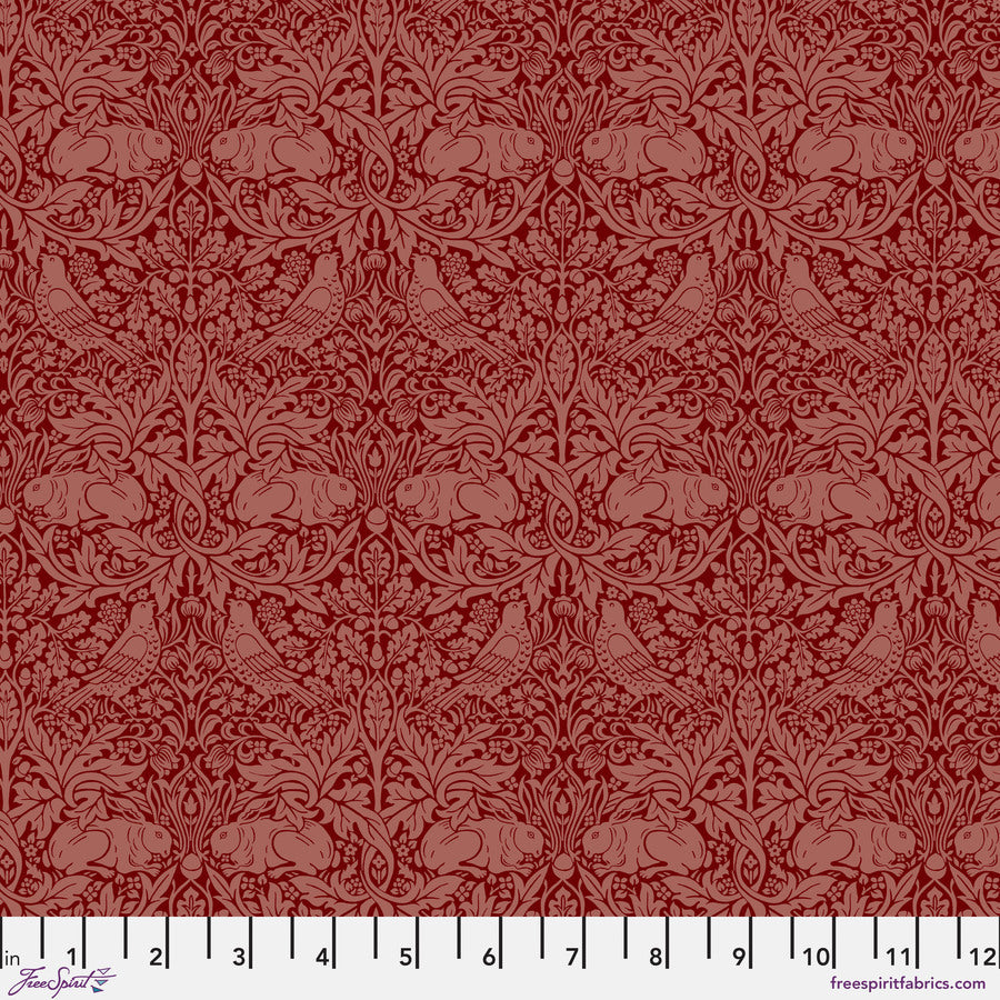 The image is a repeating pattern of red floral designs with birds and rabbits.