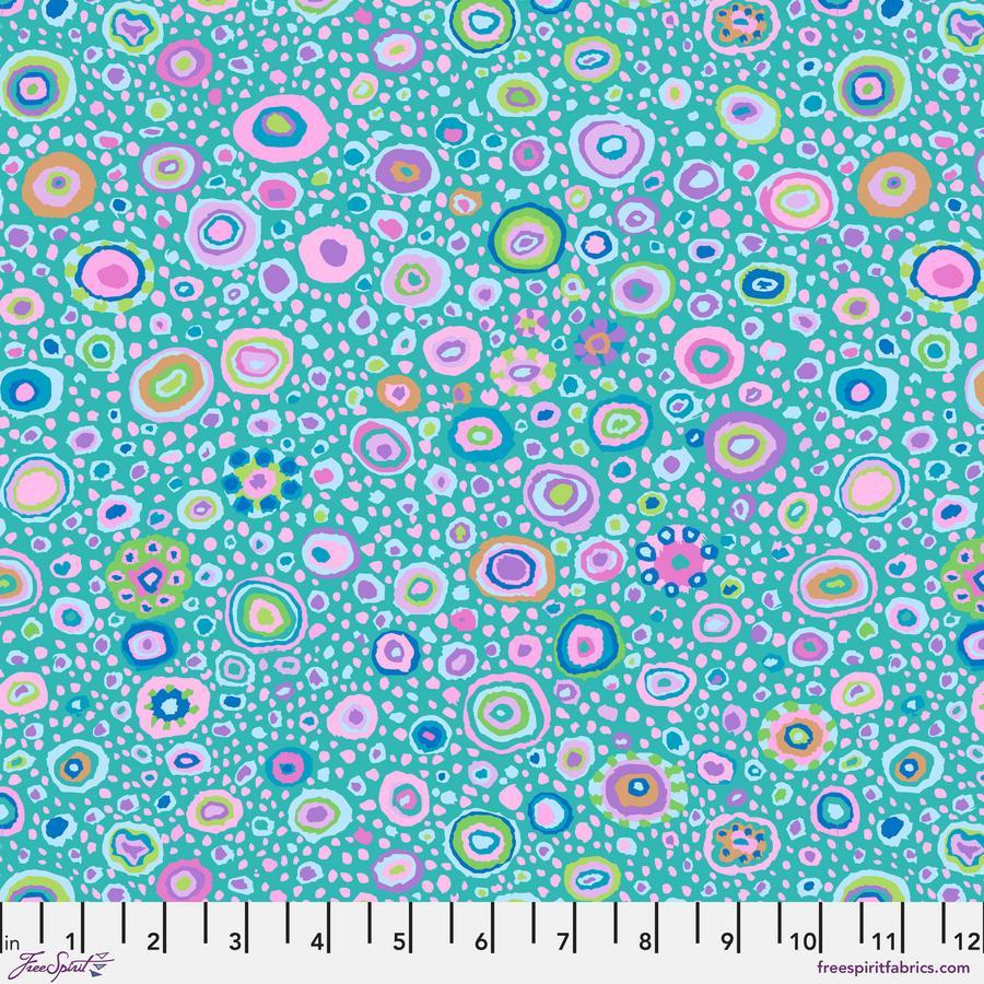The image is a vibrant and colorful abstract pattern composed of numerous circular shapes in various shades of pink, blue, green, and yellow. The pattern is spread across the entire image, creating a visually striking and dynamic composition.