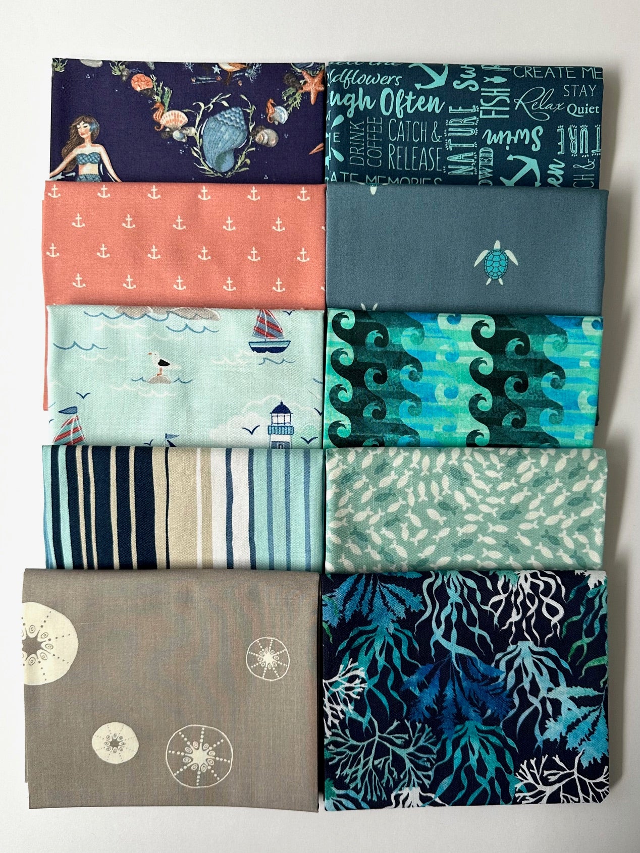 a collection of nine fabric swatches, each with a unique pattern and color, arranged in a grid-like pattern.