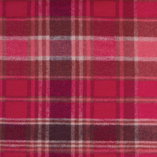 The image is a close-up of a fabric with a plaid pattern, featuring a repeating diagonal grid of red and pink squares.