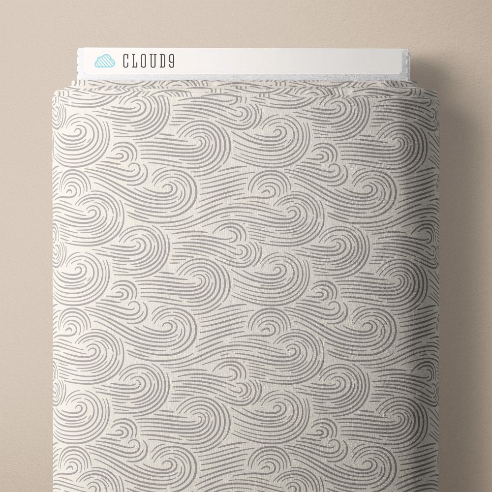 a fabric with a repeating wave pattern in shades of gray and white.