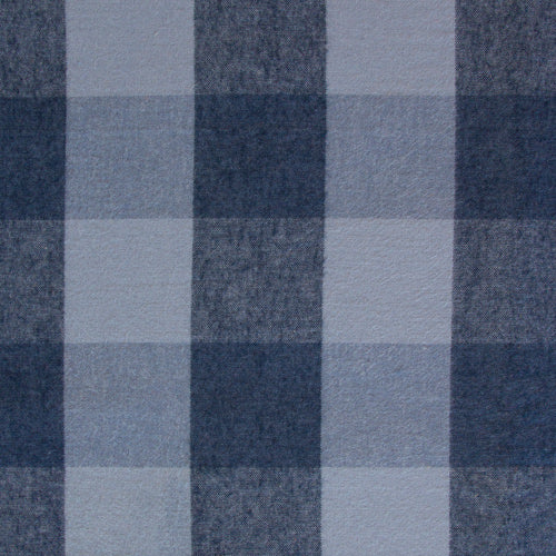 a close-up view of a fabric with a blue and white checkered pattern. The fabric appears to be made of a material with a textured surface, giving it a somewhat rough appearance. The pattern consists of squares and rectangles, with the colors alternating between blue and white. The image does not contain any text or other discernible objects or actions.