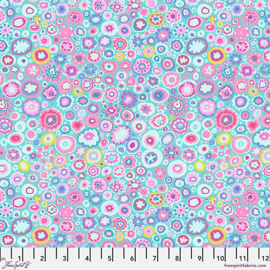 The image is a vibrant and colorful abstract pattern composed of various shapes and colors, including circles, ovals, and other organic forms. The pattern is filled with a variety of shades of pink, blue, green, and yellow, creating a lively and dynamic visual effect. The image does not contain any discernible text or specific actions, and the focus is on the overall composition and the use of color and shape.
