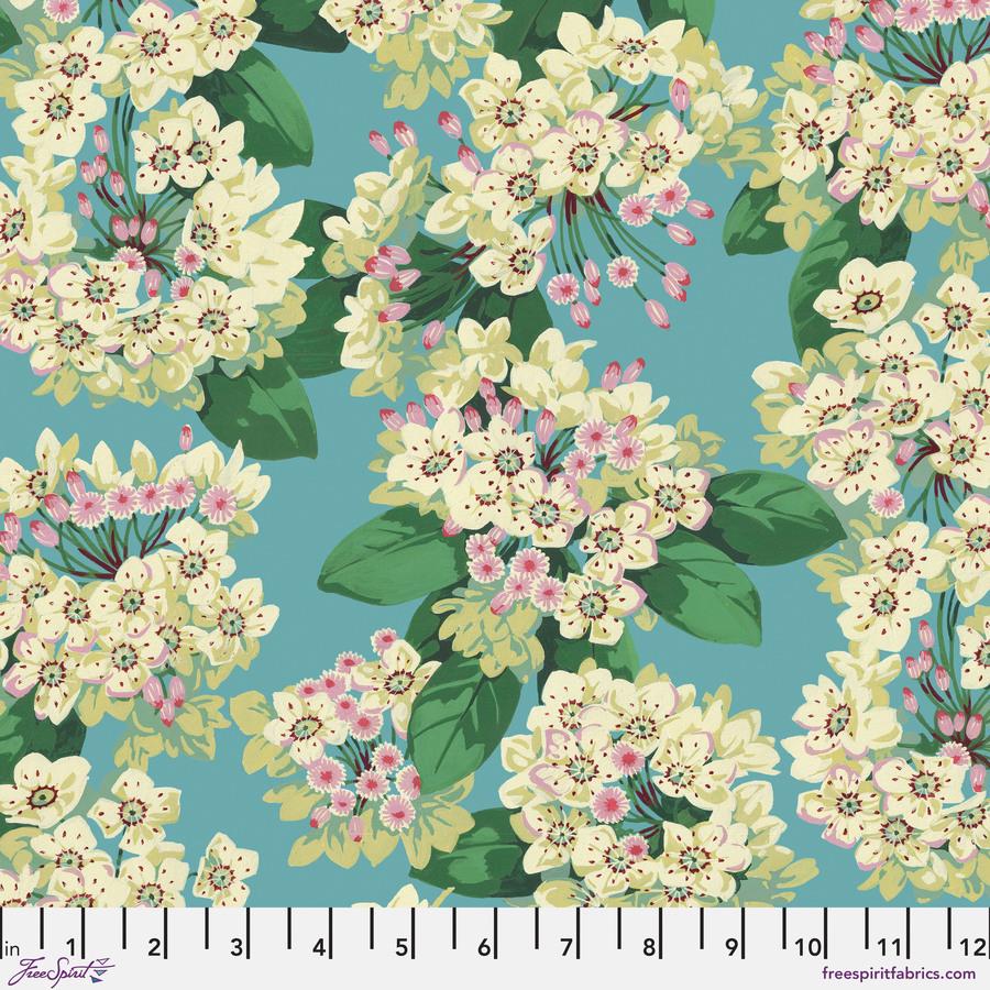 a blue background with white flowers and green leaves