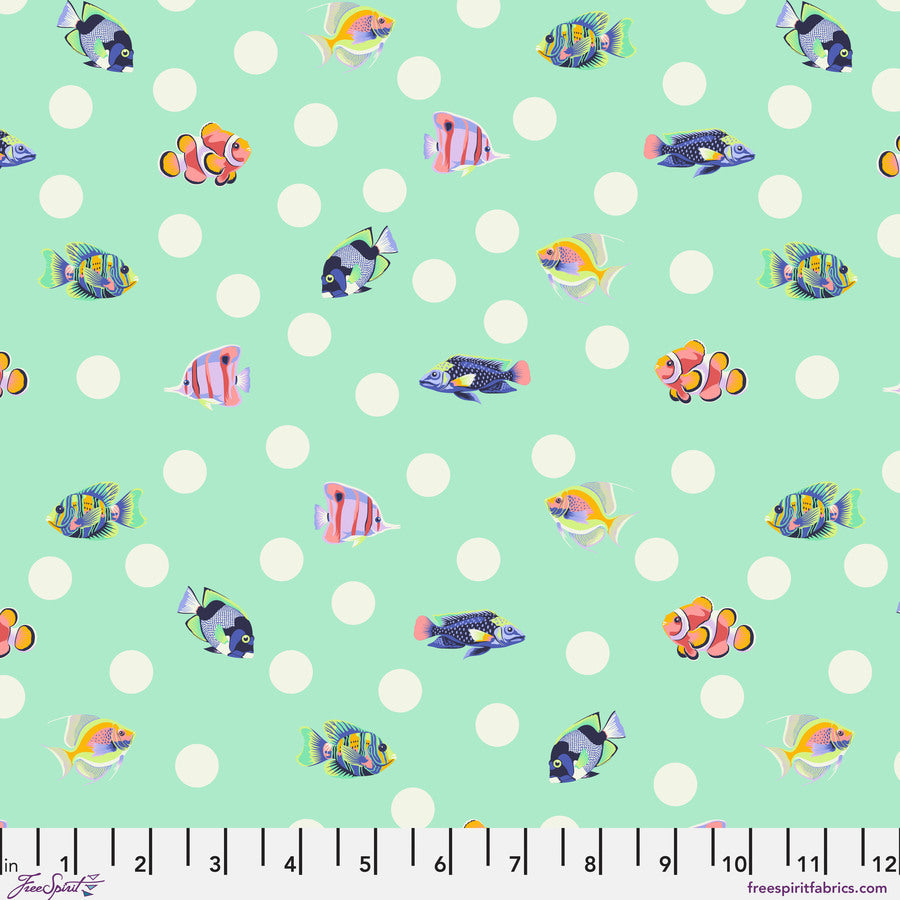 a variety of colorful fish swimming against a light green background with white polka dots.