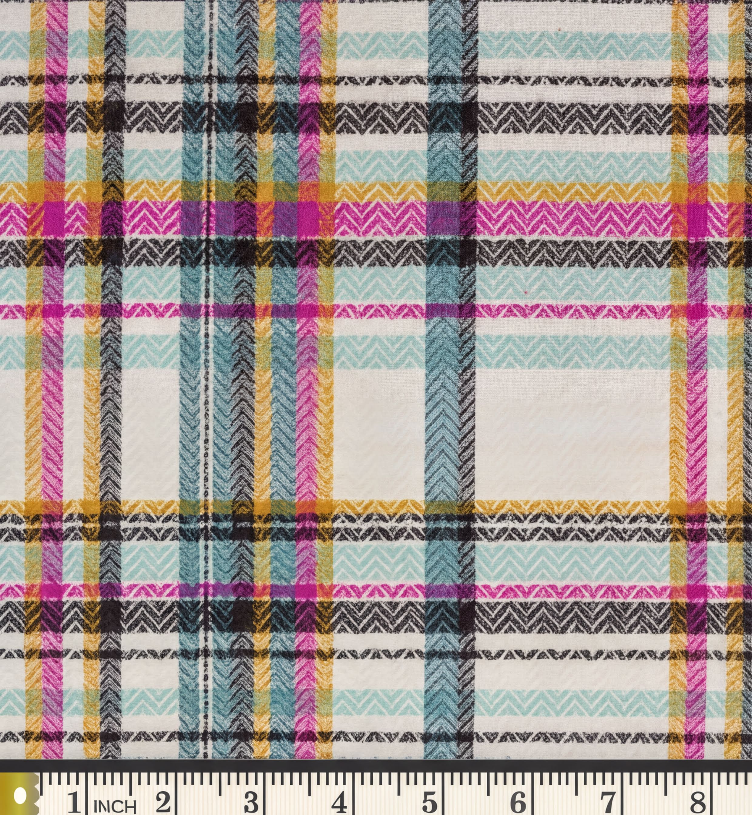 a close-up view of a fabric with a colorful, checkered pattern in shades of pink, blue, green, and yellow. The fabric appears to be made of a woven material, possibly cotton or linen, and has a textured appearance.