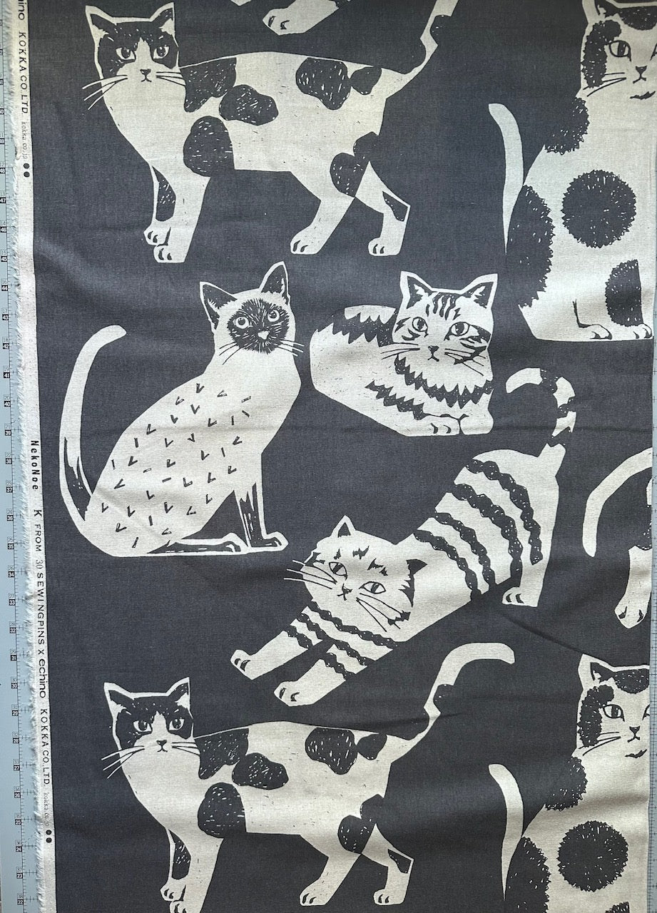 a variety of cats in different poses and positions, all depicted in black and white.