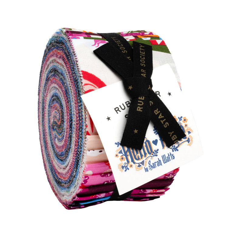 A roll of colorful fabric with a black ribbon tied around it, and a white label attached to the ribbon.