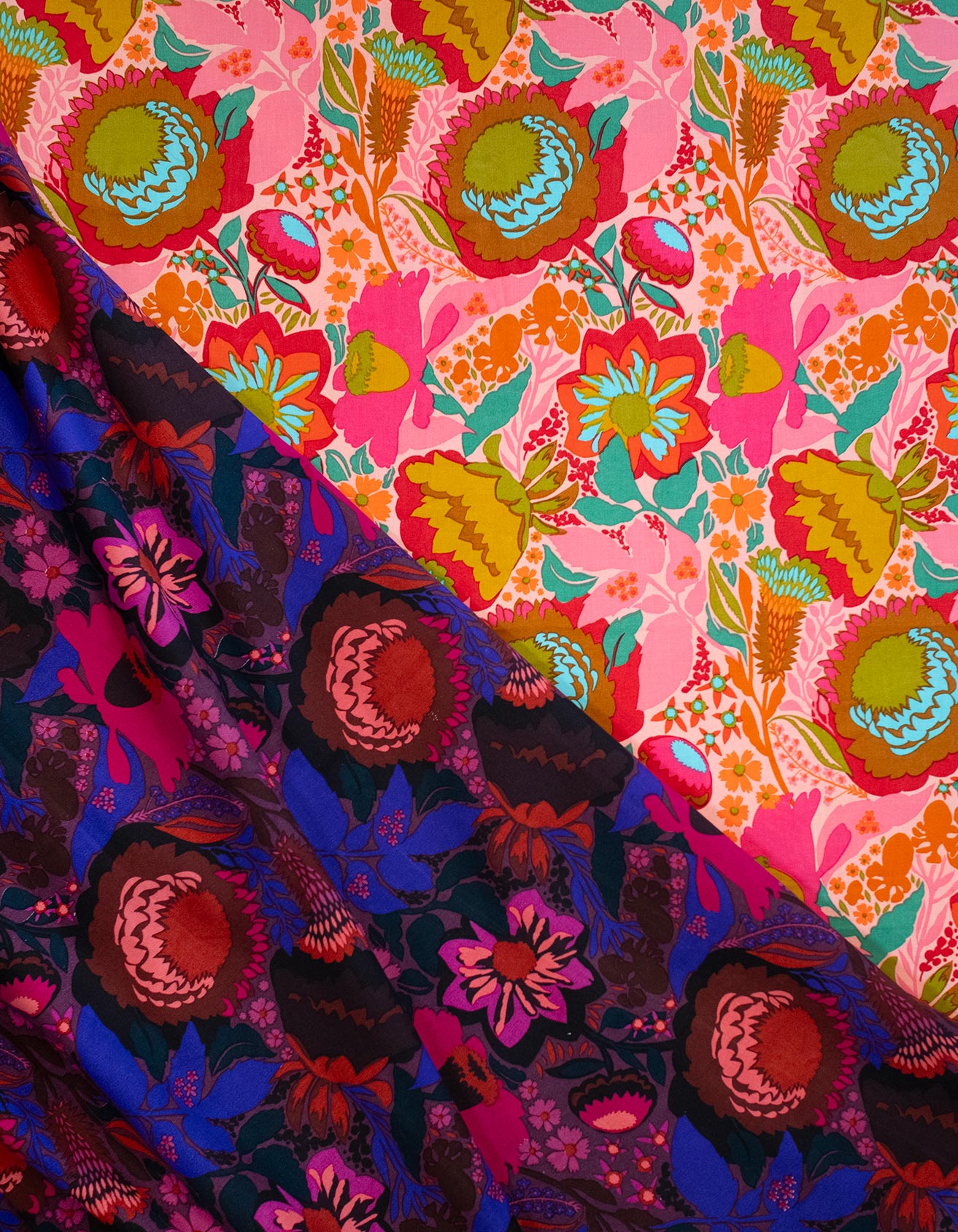 a vibrant and colorful floral pattern with a mix of pink, blue, and green hues. The pattern is composed of various flowers and leaves, creating a visually striking and lively design.