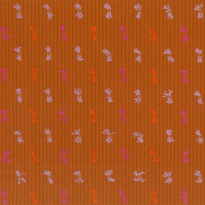 a repeating pattern of small white and pink flowers or leaves on a brown background.