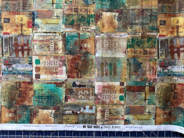 The image is a collage of various colorful and textured fabric squares, creating a visually striking and intricate pattern.