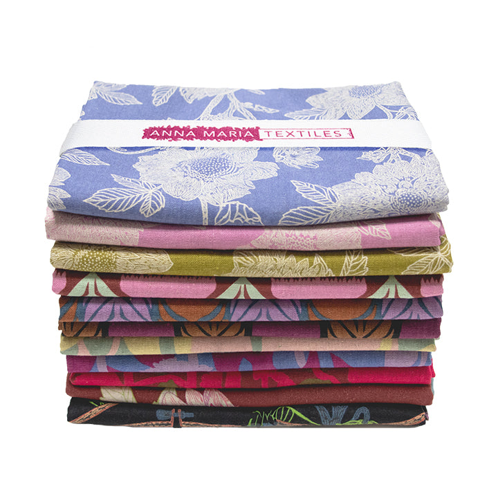 A stack of colorful fabric swatches, each with a unique floral pattern, arranged in a visually appealing manner.