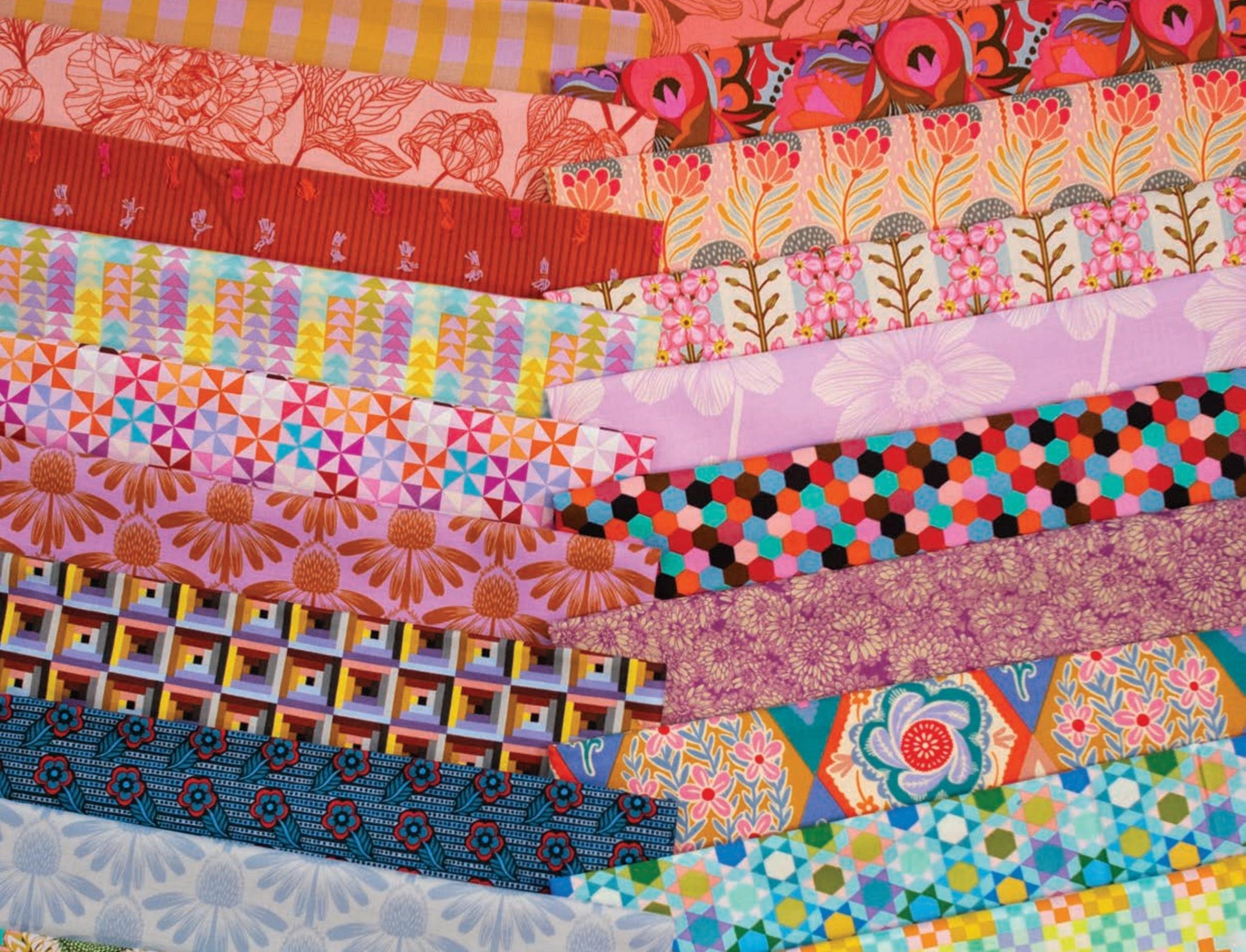 The image is a vibrant display of various colorful fabric patterns and designs, creating a visually striking and diverse collection.