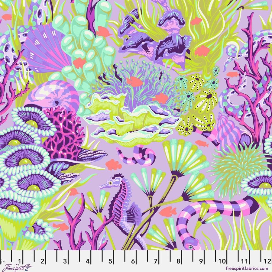 The image is a vibrant and colorful underwater scene featuring various marine life, including fish, coral, and sea creatures, all set against a purple and green background.