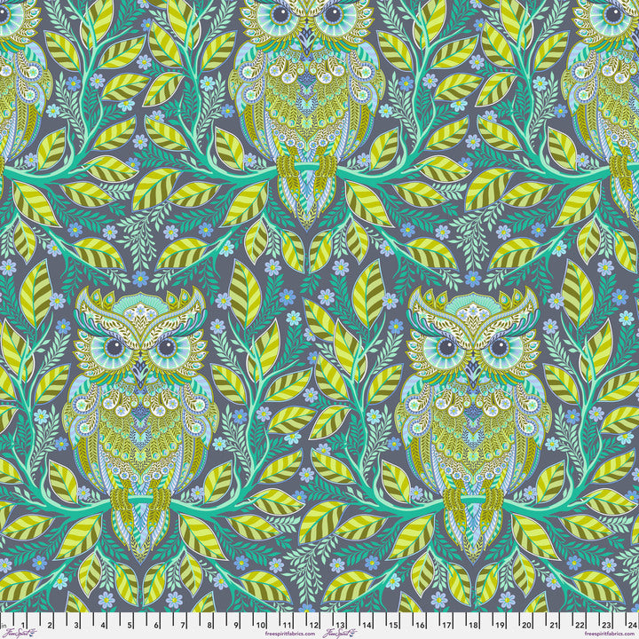 an owl and leaves pattern on a blue background