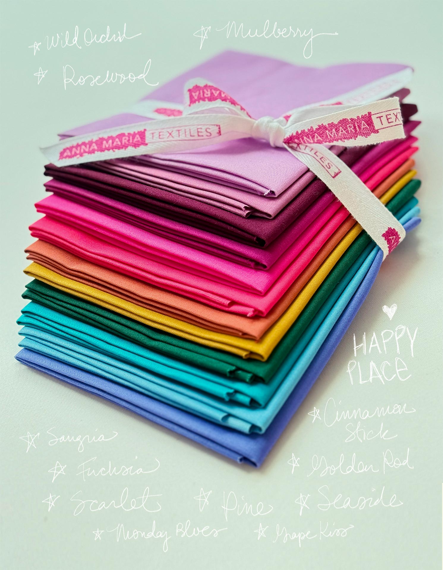 A stack of colorful fabric swatches tied together with a ribbon, accompanied by handwritten text describing the fabrics.