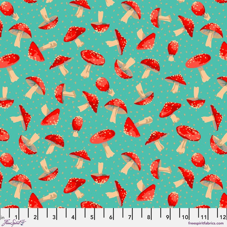 a pattern of red and white mushrooms against a teal background.