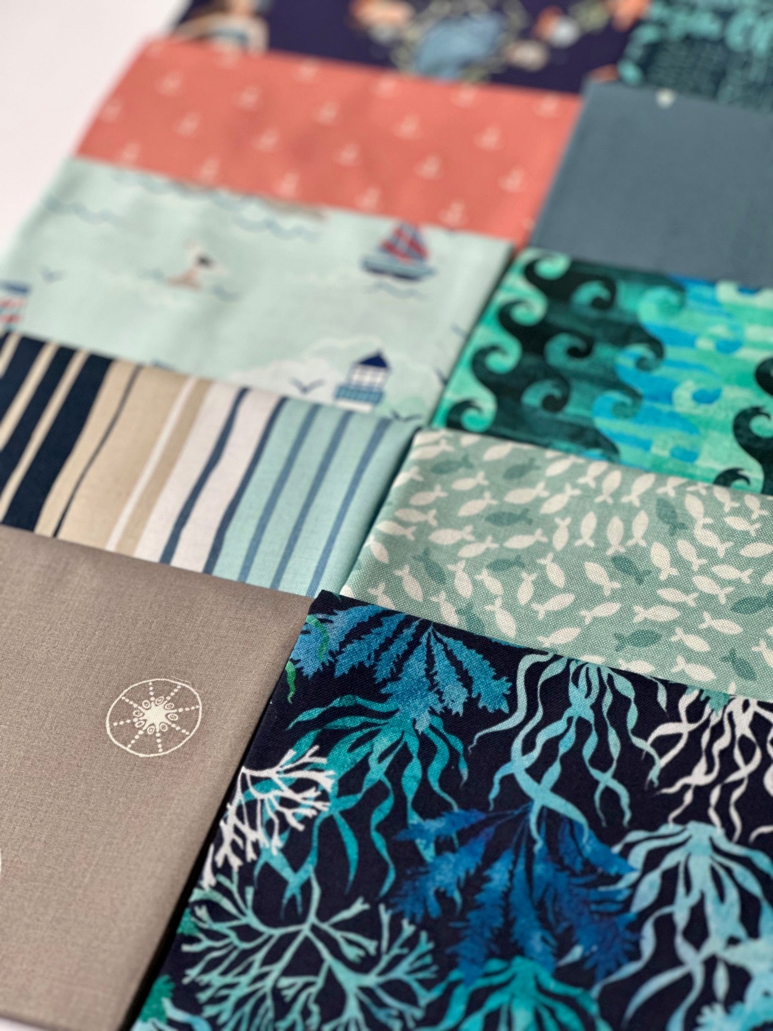 The image is a collage of various fabric swatches, showcasing a range of colors and patterns.