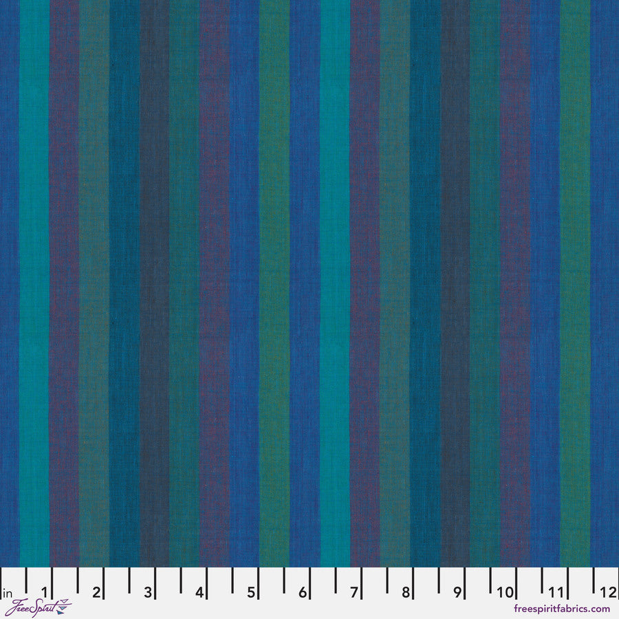 The image is a fabric with vertical stripes in various colors, including blue, green, and purple. The fabric appears to be a textile or material with a striped pattern.