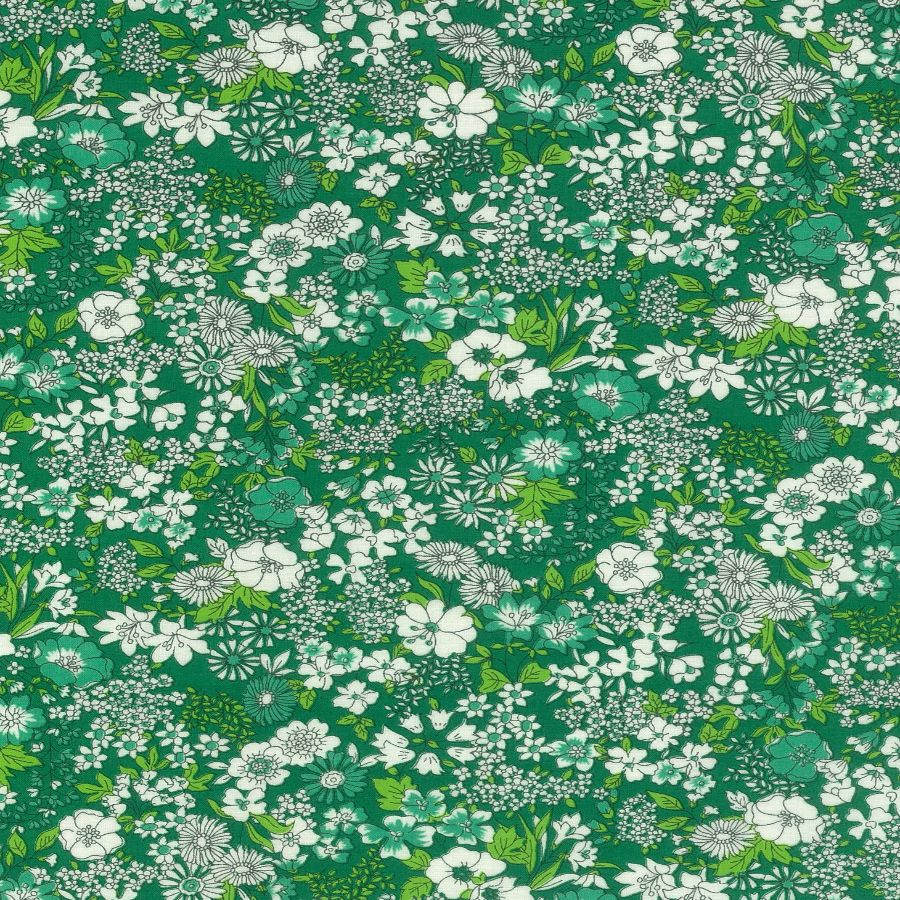The image is a vibrant and lush collage of various white and green flowers and leaves, creating a visually striking and intricate pattern.