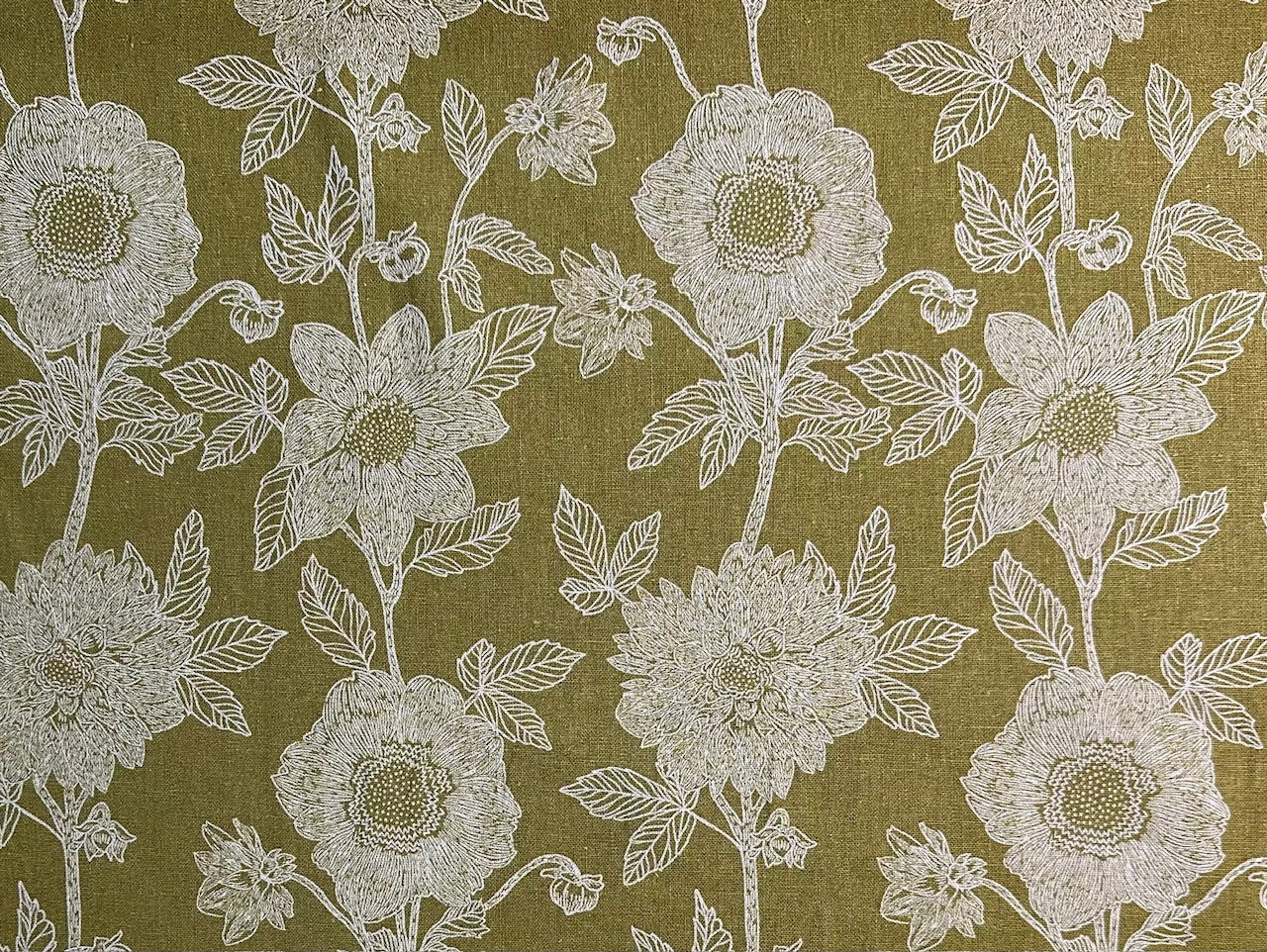 a repeating pattern of white flowers with green leaves on a dark green background.